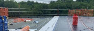 Ongoing flat roof replacement with insulation boards laid, vapour control layer in place and baselayer